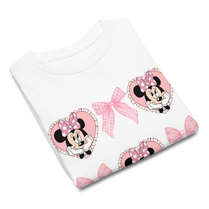  Girls Minnie Mouse t-shirt with coquette design featuring pink bows and hearts, ideal for Disney vacations or birthdays.