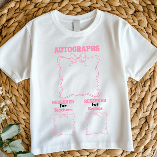Close-up shot of cute pink coquette themed last day of school t-shirt with a fun, feminine design.