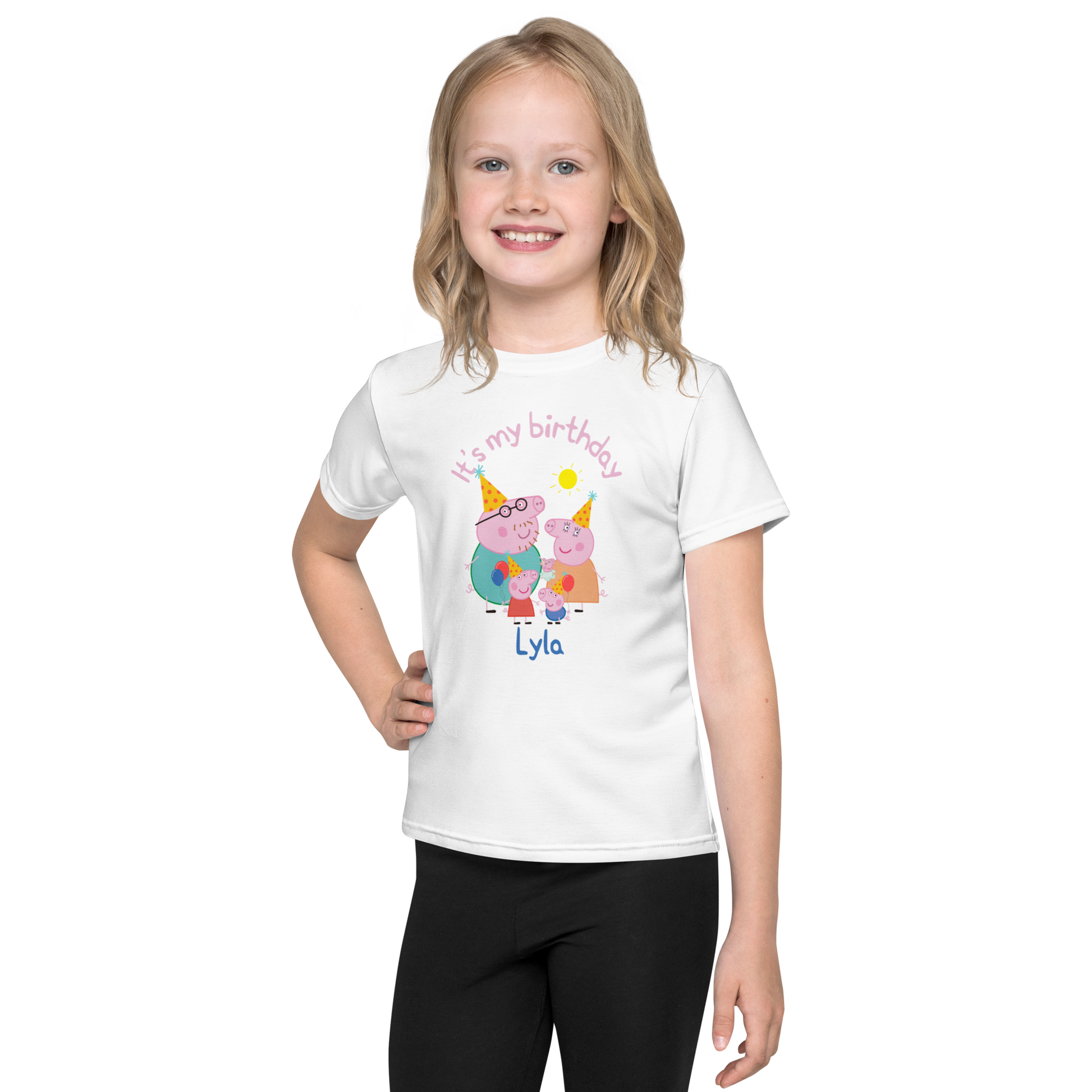 Toddler wearing a personalised Peppa Pig birthday t-shirt during a cake smash photo session, with icing on the shirt and a joyful expression on their face.
