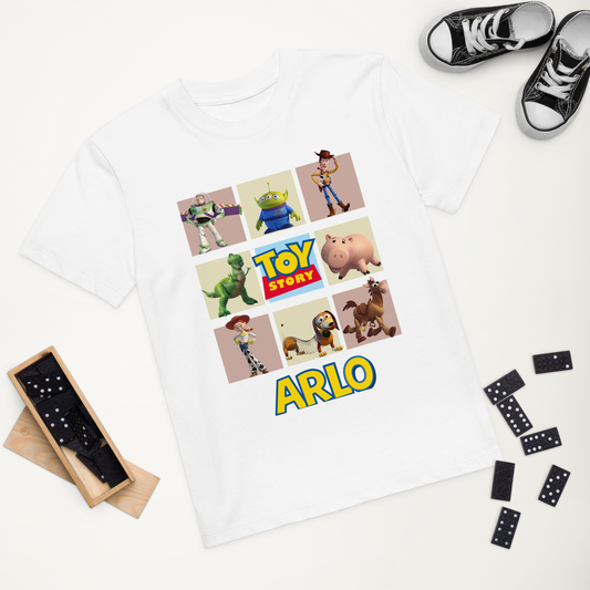 White children’s t-shirt with Toy Story print and name ARLO in bold yellow and blue font