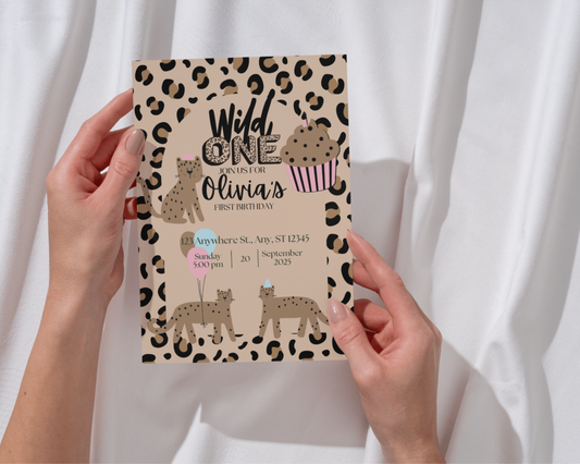 Girly Wild One birthday invitation with leopard print and cupcake design